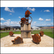 Artist 	Jimmy Rix Title 	Sheepish Year 	2012 Medium 	Corten Steel, cast iron and timber Height 	4.4 m